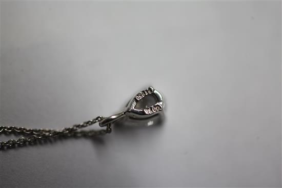 A Tiffany & Co platinum and pear shaped solitaire diamond pendant, pendant 0.25in.